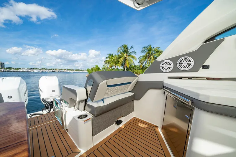 Slide: The Image of Manufacturer Provided Image: 2025 Tiara Yachts 34 LX interior with luxurious seating and scenic waterfront view. - 8