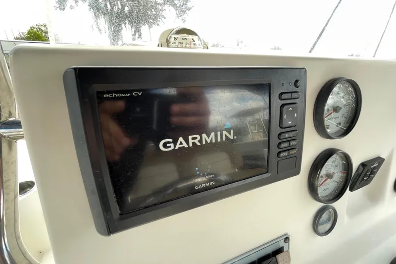 Slide: The Image of Garmin navigation system on 2014 Key West 210 Bay Reef boat dashboard. - 12