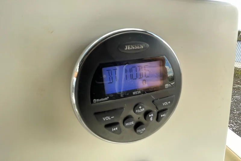 Slide: The Image of Jensen audio system on 2014 Key West 210 Bay Reef boat dashboard. - 13