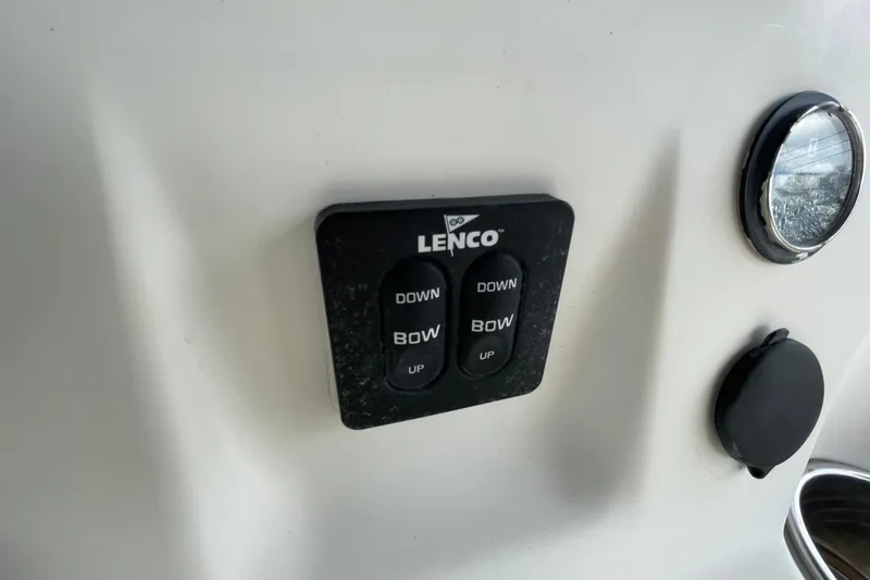 Slide: The Image of Lenco trim tab control on 2014 Key West 210 Bay Reef boat dashboard. - 14