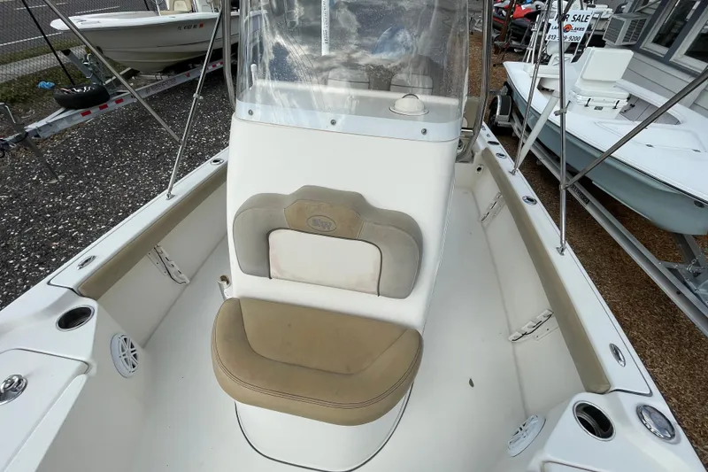 Slide: The Image of 2014 Key West 210 Bay Reef boat interior with seating and console. - 17