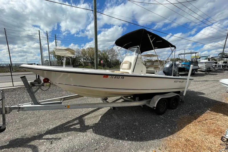 Slide: The Image of 2014 Key West 210 Bay Reef boat on trailer under cloudy sky. - 5