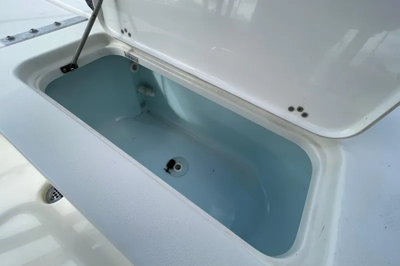 Slide: The Image of Open storage compartment on a 2014 Key West 210 Bay Reef boat. - 8