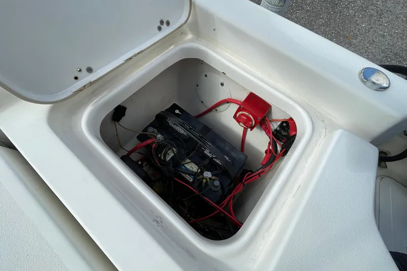 Slide: The Image of Battery compartment of 2014 Key West 210 Bay Reef boat with wiring and connections. - 9