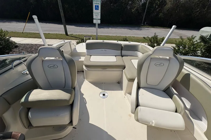 Slide: The Image of 2011 Sea Ray 185 Sport boat interior with seating and steering wheel. - 12