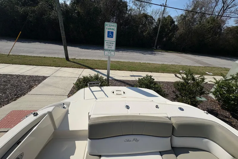 Slide: The Image of 2011 Sea Ray 185 Sport boat parked near accessible parking sign. - 18