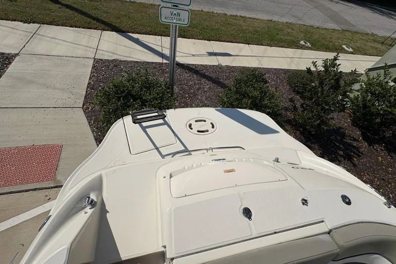 Slide: The Image of 2011 Sea Ray 185 Sport boat parked near a van-accessible sign. - 19