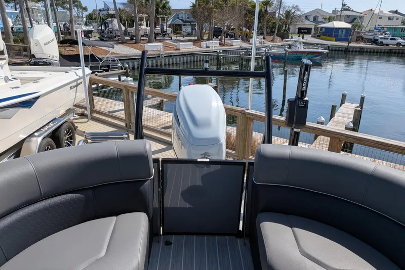 Slide: The Image of 2022 South Bay 525 RS pontoon boat at dockside with scenic marina view. - 12