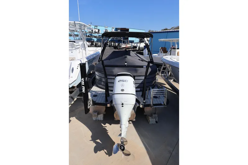 Slide: The Image of 2022 South Bay 525 RS boat with Yamaha 250 engine, docked outdoors. - 22