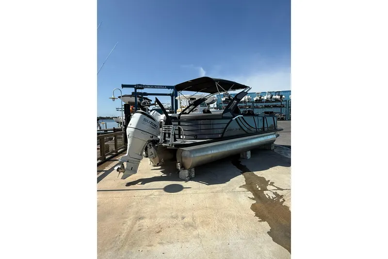 Slide: The Image of 2022 South Bay 525 RS pontoon boat with Suzuki outboard motor at marina dock. - 4