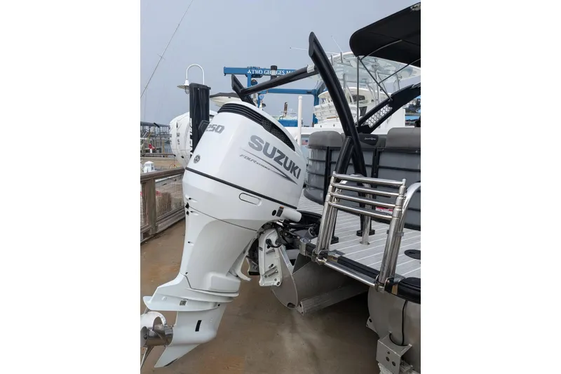 Slide: The Image of 2022 South Bay 525 RS with Suzuki outboard motor at marina. - 8