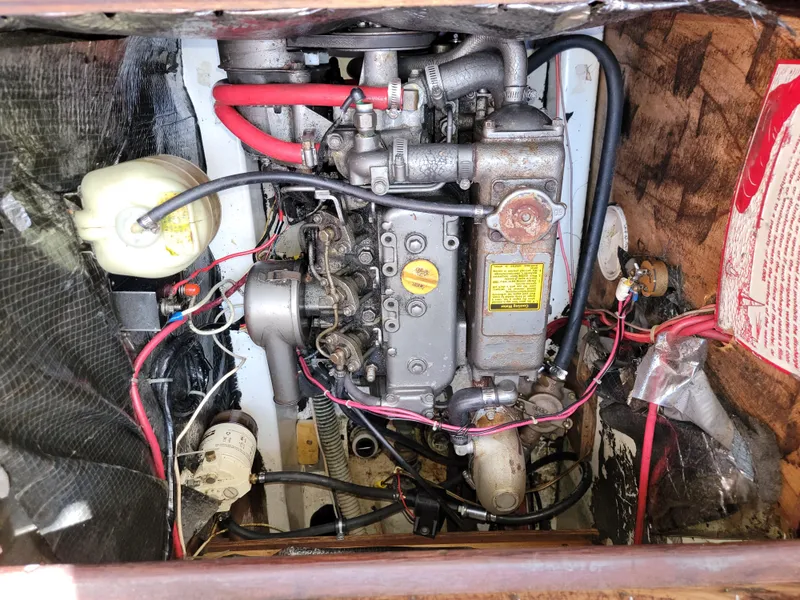 Slide: The Image of 1984 Hunter 34 engine compartment with visible wiring and components. - 40