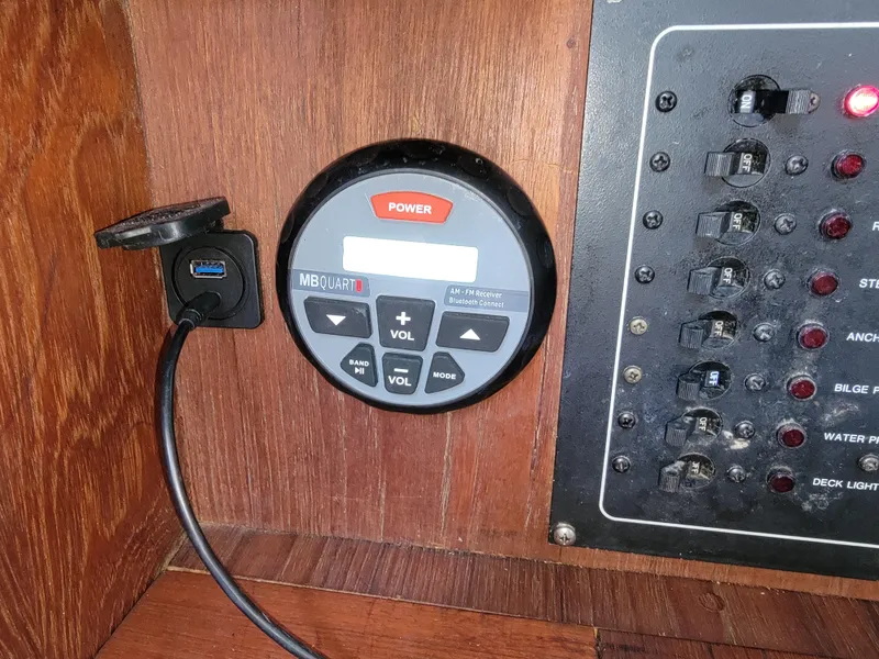 Slide: The Image of 1984 Hunter 34 boat control panel with MB Quart audio system and USB port. - 46