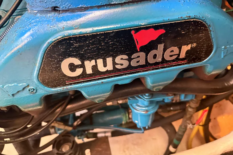 Slide: The Image of Crusader engine in 2006 Silverton 36 Convertible boat, showcasing blue machinery. - 12