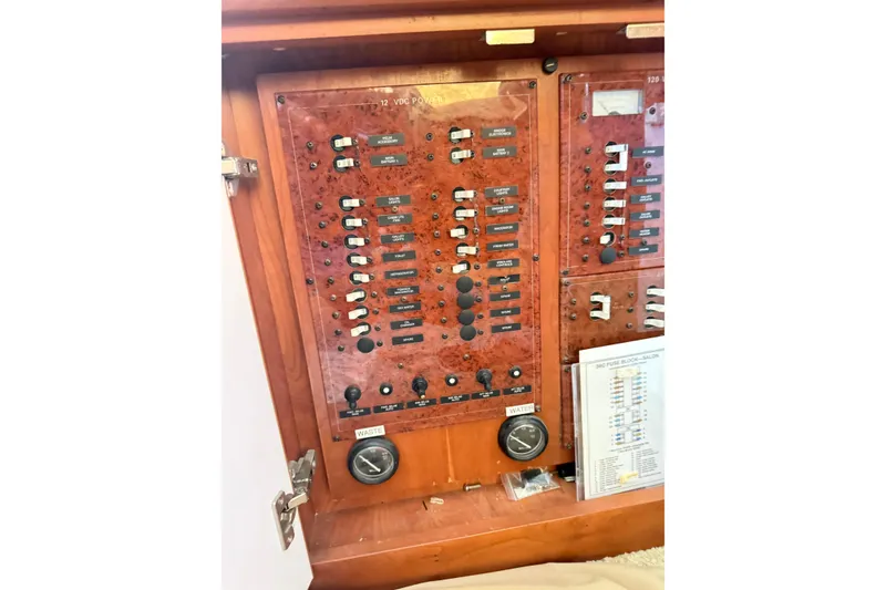 Slide: The Image of Electrical panel of a 2006 Silverton 36 Convertible boat, featuring switches and gauges. - 13