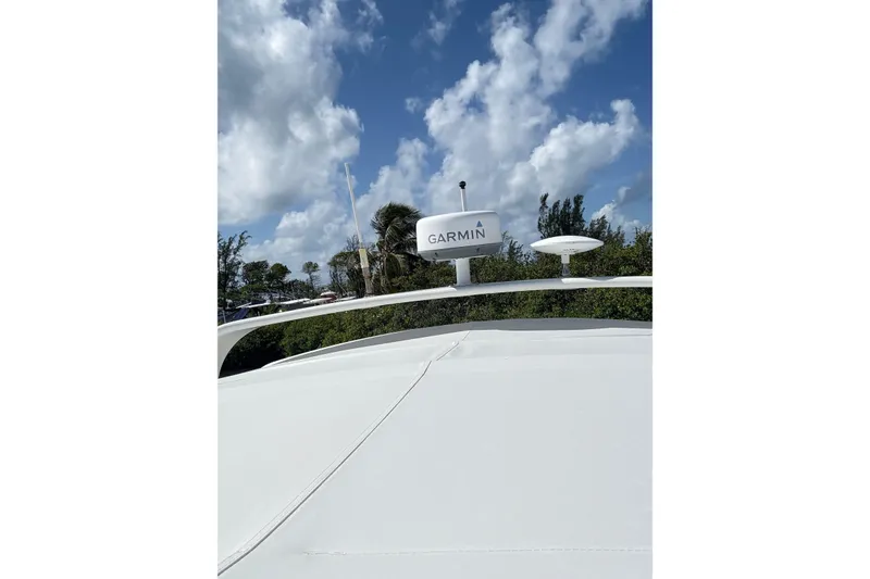 Slide: The Image of 2006 Silverton 36 Convertible boat with Garmin equipment under a cloudy sky. - 15