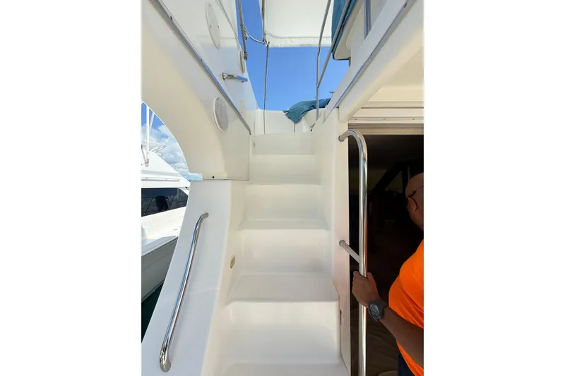 Slide: The Image of Staircase on 2006 Silverton 36 Convertible yacht with stainless steel handrails. - 16