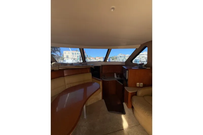 Slide: The Image of Interior of 2006 Silverton 36 Convertible yacht with spacious seating and large windows. - 24