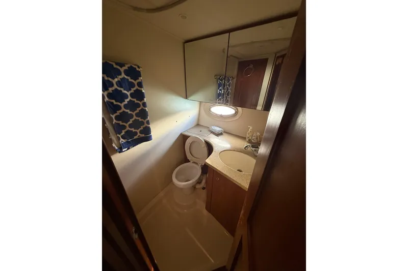 Slide: The Image of Bathroom interior of 2006 Silverton 36 Convertible yacht with sink and toilet. - 6