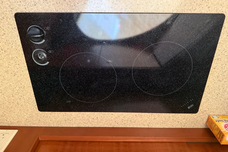 Slide: The Image of Built-in electric stove on 2006 Silverton 36 Convertible yacht kitchen countertop. - 9