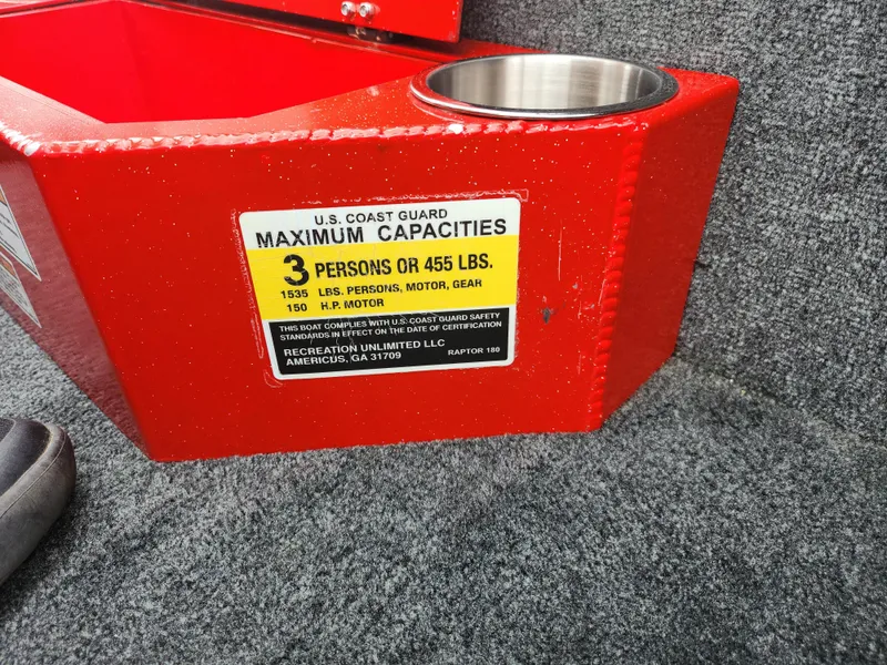 Slide: The Image of Red Caravelle Raptor 180 Bass boat with U.S. Coast Guard capacity label, 2021 model. - 14