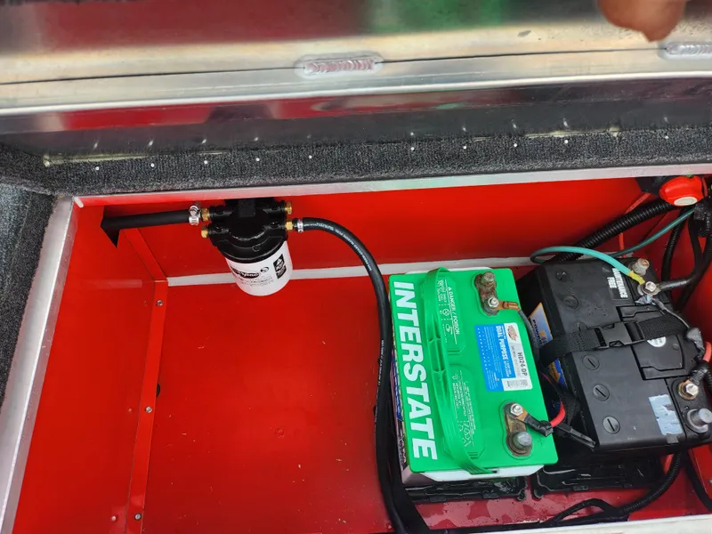 Slide: The Image of Battery compartment of 2021 Caravelle Raptor 180 Bass boat with Interstate batteries. - 23