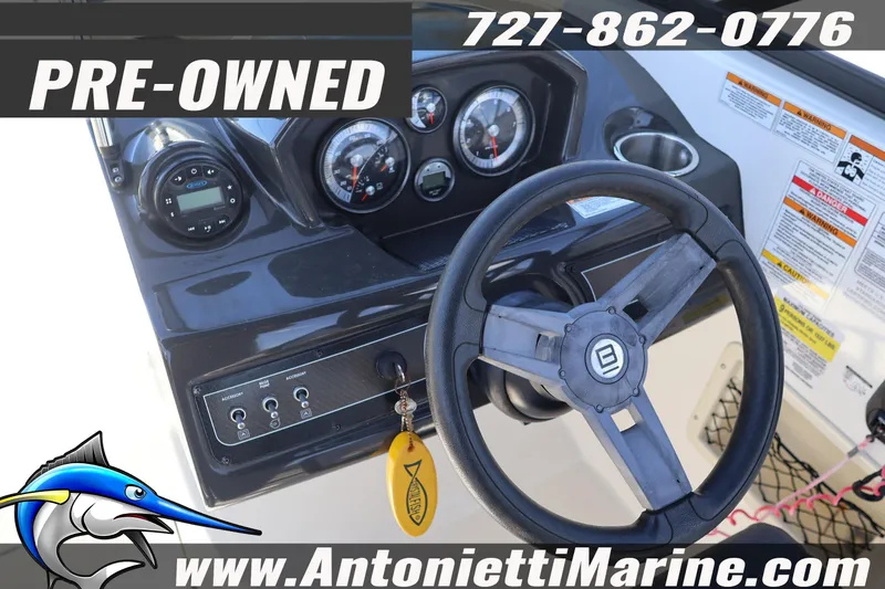 Slide: The Image of Pre-owned 2020 Bayliner VR5 Bowrider OB dashboard with steering wheel and gauges. - 12