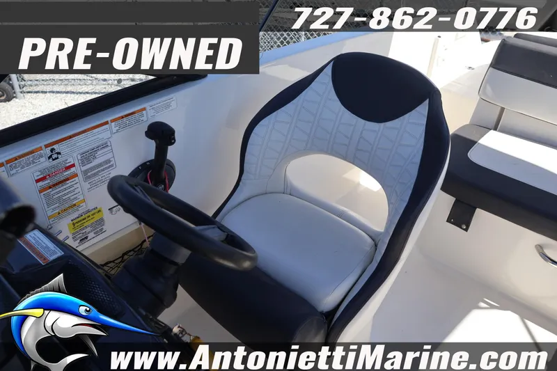 Slide: The Image of Pre-owned 2020 Bayliner VR5 Bowrider OB interior with steering wheel and seating. - 22