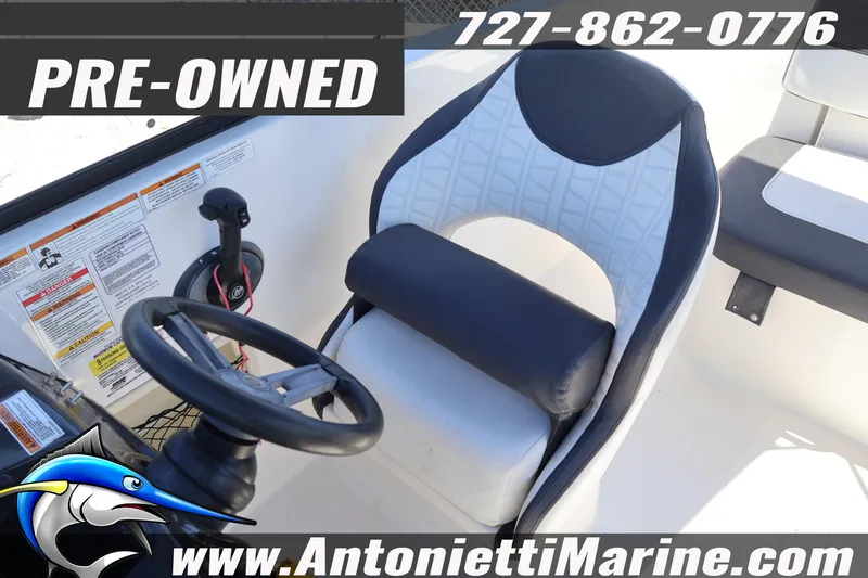 Slide: The Image of Pre-owned 2020 Bayliner VR5 Bowrider OB boat interior with steering wheel and seat. - 23