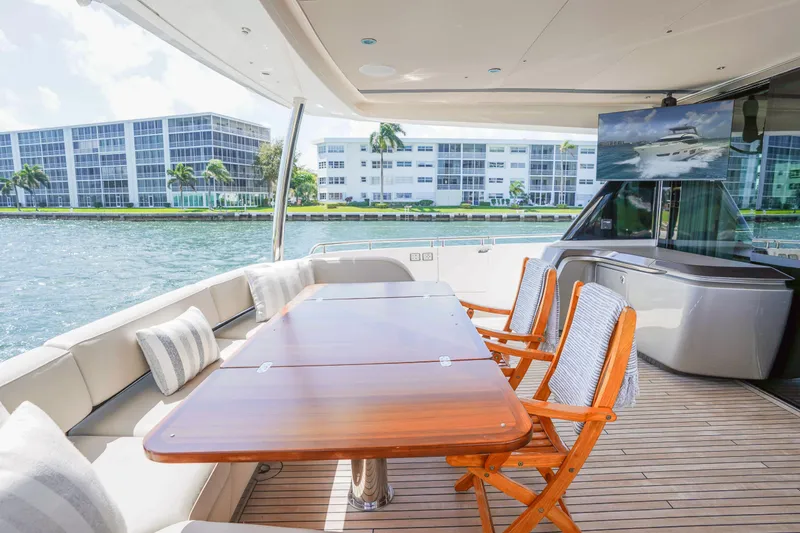 Slide: The Image of Luxurious 2021 Princess Y85 yacht deck with elegant seating and waterfront view. - 11