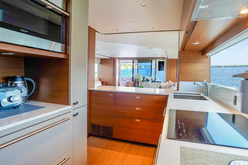 Slide: The Image of Luxurious kitchen interior of 2021 Princess Y85 yacht with modern appliances and scenic water view. - 21