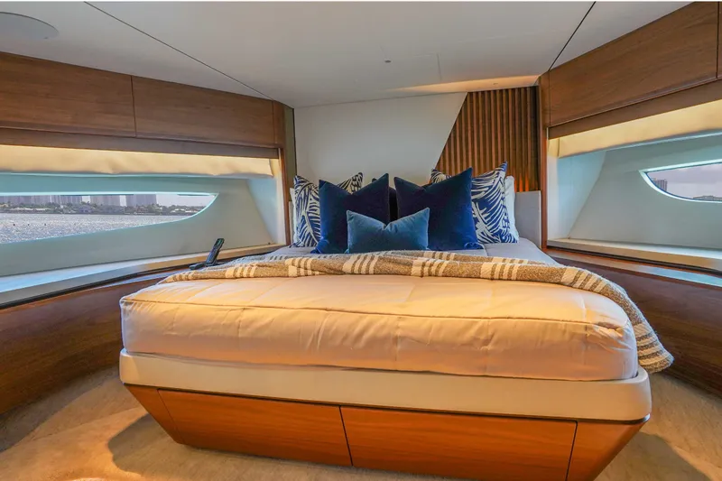 Slide: The Image of Luxurious bedroom interior of 2021 Princess Y85 yacht with elegant bedding and scenic windows. - 27