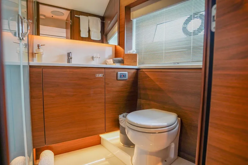 Slide: The Image of Luxurious bathroom in 2021 Princess Y85 yacht with wooden cabinetry and modern fixtures. - 29