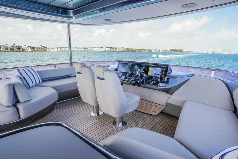 Slide: The Image of Luxurious 2021 Princess Y85 yacht interior with modern helm and plush seating. - 5