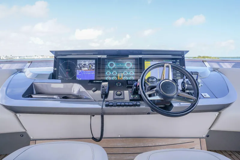 Slide: The Image of Helm of 2021 Princess Y85 yacht with advanced navigation displays and controls. - 6