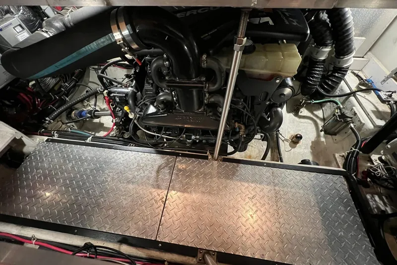 Slide: The Image of Engine room of a 2001 Carver 396 Motor Yacht with visible components and wiring. - 13