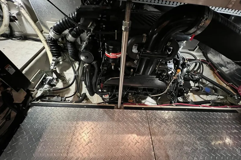 Slide: The Image of Engine room of a 2001 Carver 396 Motor Yacht with visible components and wiring. - 15