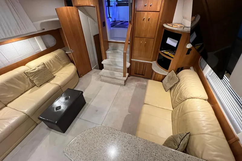 Slide: The Image of Luxurious interior of 2001 Carver 396 Motor Yacht with beige leather seating. - 19