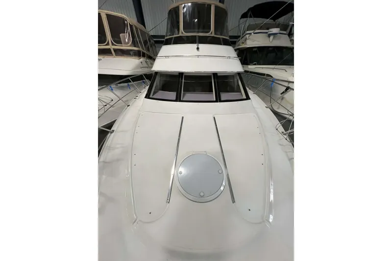 Slide: The Image of 2001 Carver 396 Motor Yacht, front deck view in marina setting. - 7