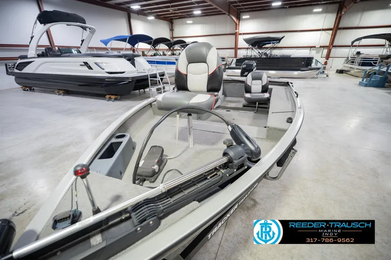Slide: The Image of 2007 Tracker Tournament V-18 boat in showroom, featuring modern seating and equipment. - 12