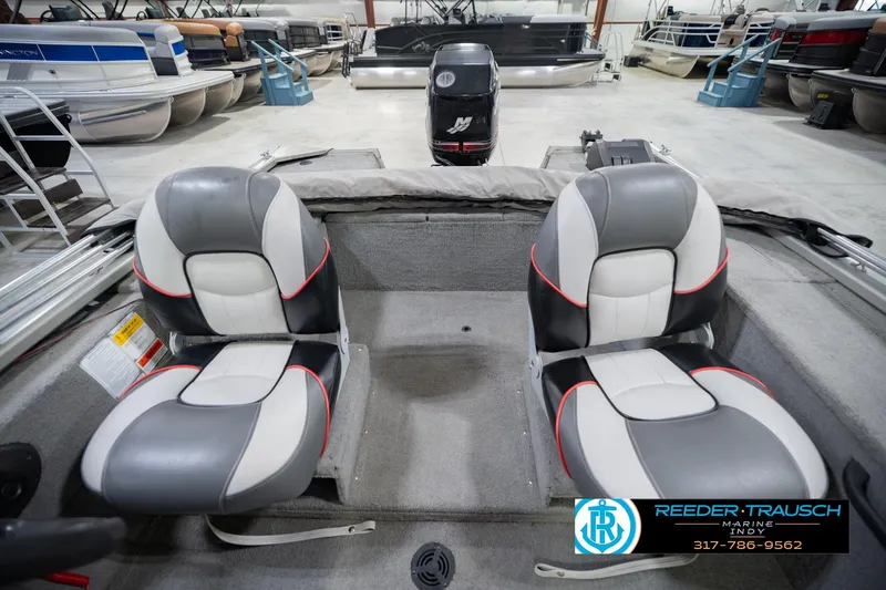 Slide: The Image of 2007 Tracker Tournament V-18 boat interior with dual seats in showroom. - 21
