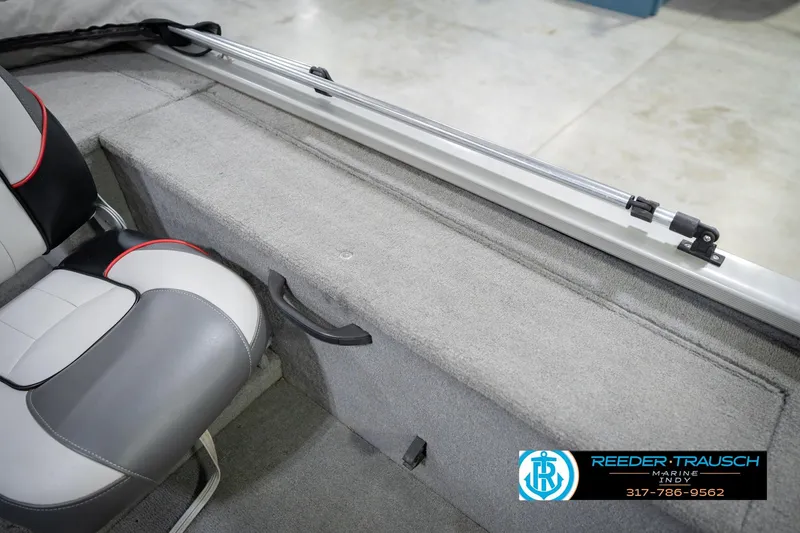 Slide: The Image of 2007 Tracker Tournament V-18 boat interior with seating and storage compartment. - 22