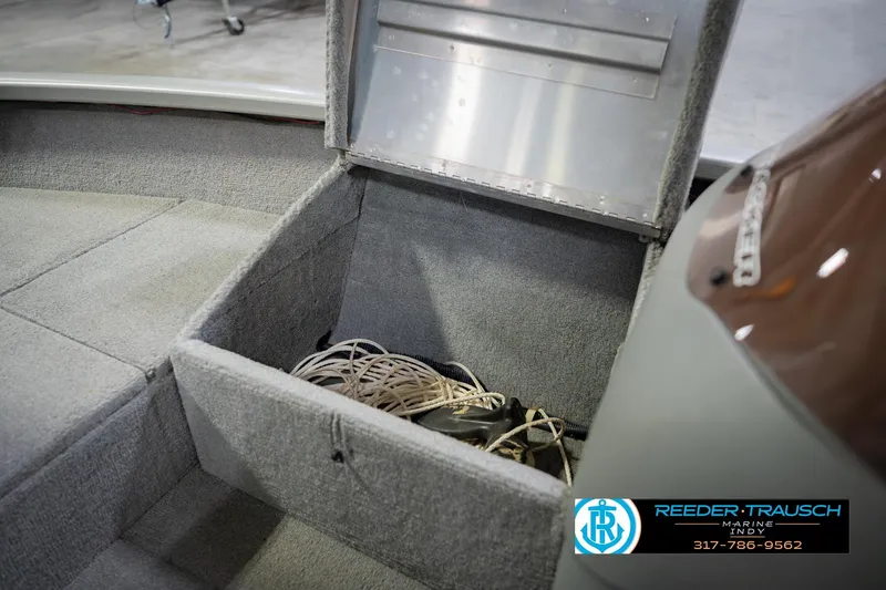 Slide: The Image of Open storage compartment in 2007 Tracker Tournament V-18 boat, featuring interior details and equipment. - 27