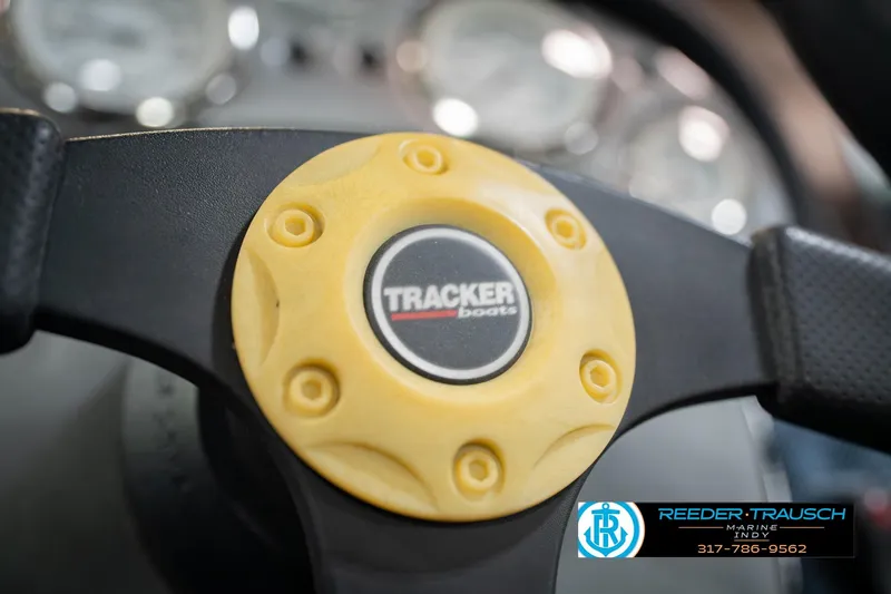 Slide: The Image of Steering wheel of 2007 Tracker Tournament V-18 boat with logo and Reeder-Trausch Marine contact. - 30