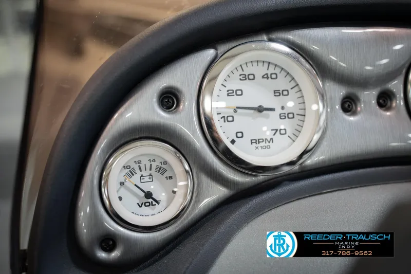 Slide: The Image of Dashboard gauges of a 2007 Tracker Tournament V-18 boat, featuring RPM and voltage indicators. - 32
