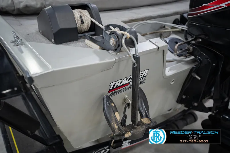 Slide: The Image of 2007 Tracker Tournament V-18 boat with anchor and motor, Reeder-Trausch Marine logo visible. - 40