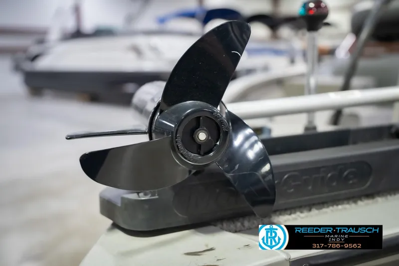 Slide: The Image of Close-up of a 2007 Tracker Tournament V-18 boat propeller in a showroom. - 49