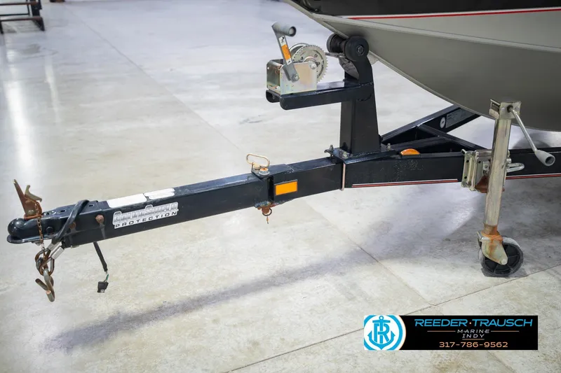 Slide: The Image of Trailer hitch of a 2007 Tracker Tournament V-18 boat in a showroom. - 50