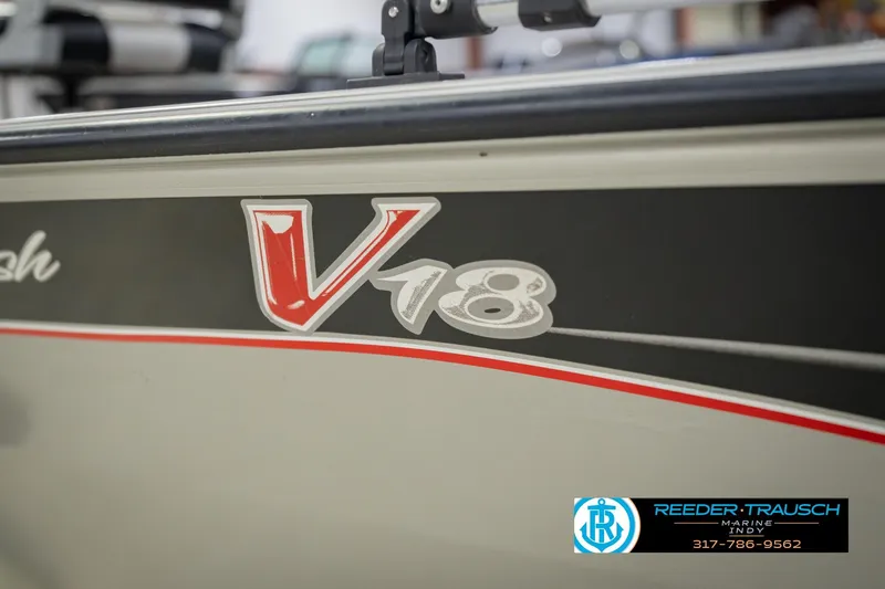Slide: The Image of 2007 Tracker Tournament V-18 boat with red and white graphics, Reeder Trausch Marine logo. - 54