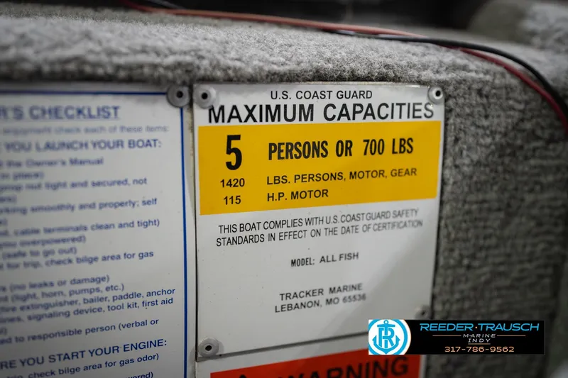 Slide: The Image of 2007 Tracker Tournament V-18 boat capacity label, maximum 5 persons or 700 lbs. - 57
